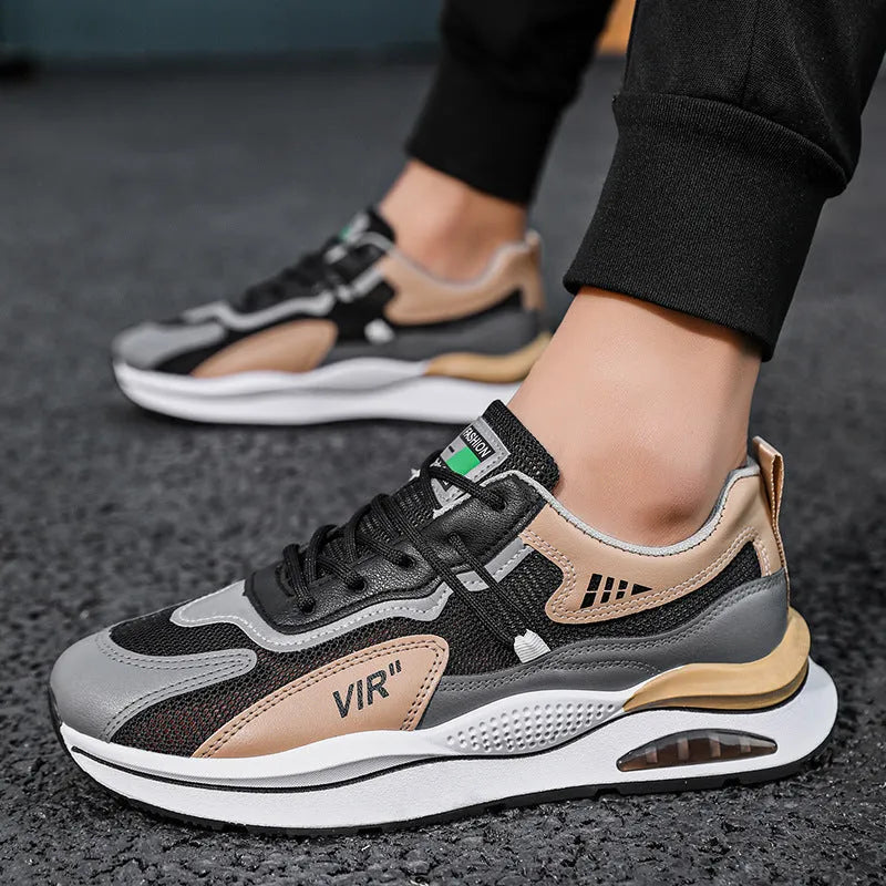 Men's grey and black mesh running shoes with round toe and mid-top design on white background