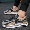 Men's grey and black mesh running shoes with round toe and mid-top design on white background