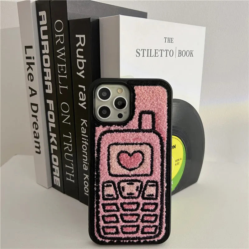 Pink towel embroidered soft TPU back cover case for Apple iPhone mobile phones.