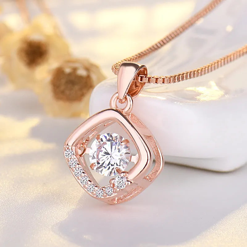 Sterling silver heart necklace with crown and bow pendant on adjustable chain