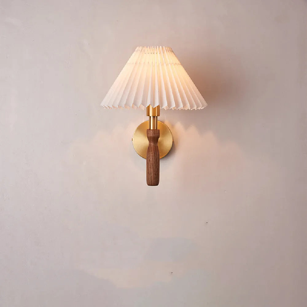 American retro walnut wood wall lamp with fabric shade on a wooden bedside table