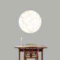 Moon pendant light in a double-height restaurant or living room – D40 or D50 size – low-voltage 36V – light luxury style