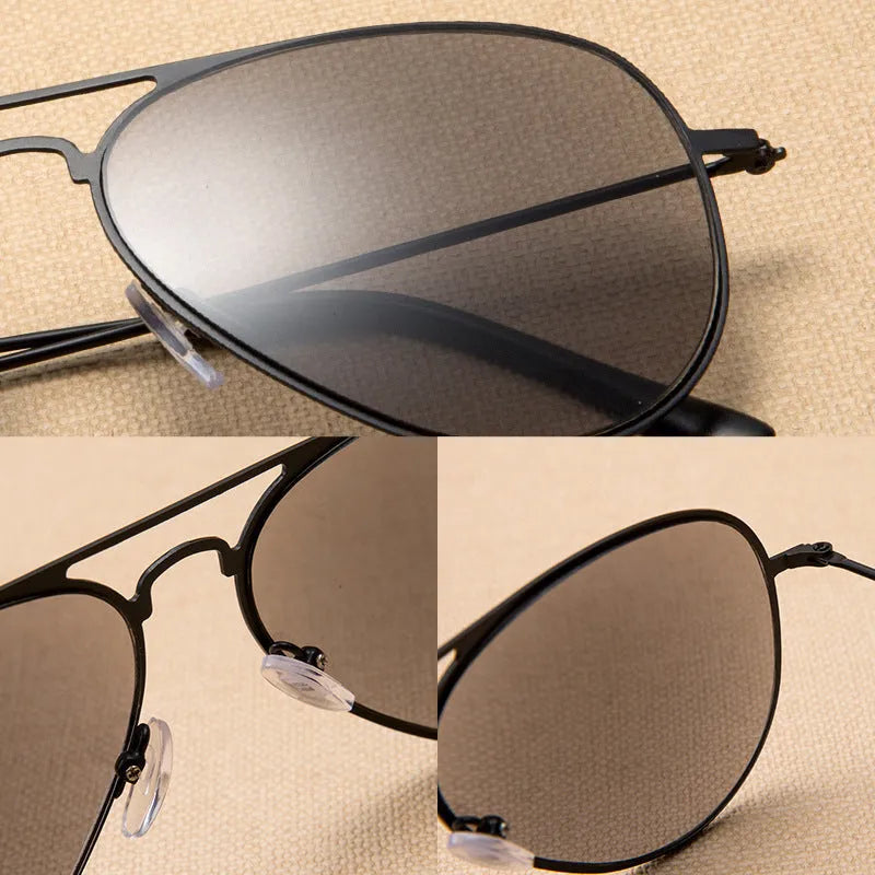 Full lens sun reading glasses with black stainless steel frame resting on a table
