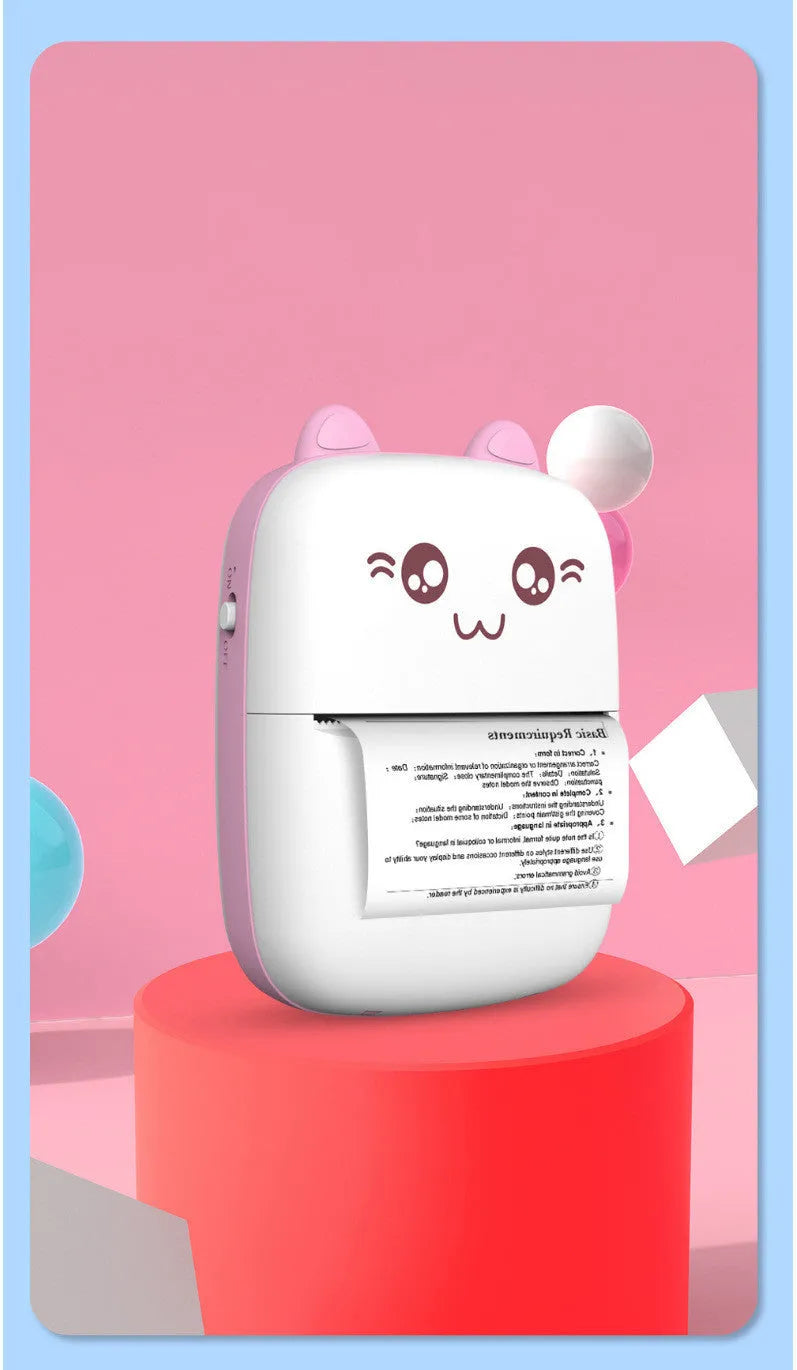 Mini Bluetooth thermal printer in pink with paper roll and phone app interface