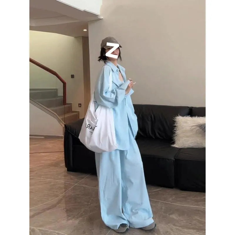 Women's blue shirt and wide-leg pants suit with flight sleeve and button stitching details