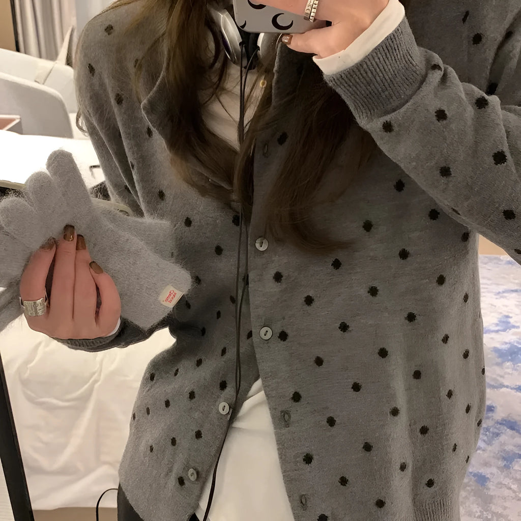 Women's grey dot pattern knitted cardigan with long sleeves and crocheted flower details