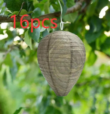 A rectangular photo colour beehive lantern with a honeycomb paper structure and wire frame.