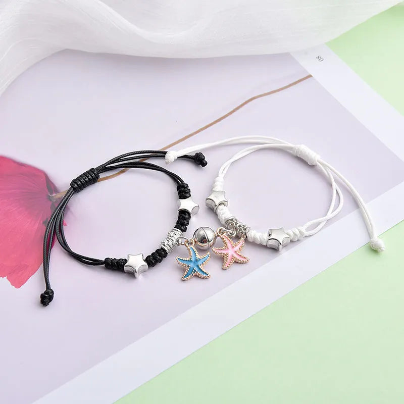 Alloy magnetic suction bracelet pair for couples with symbolic design options