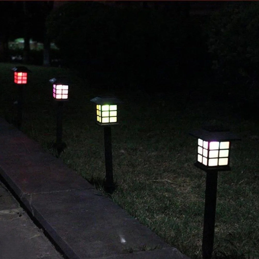 Solar square lawn light with LED, IP44, in a garden setting showing white light illumination