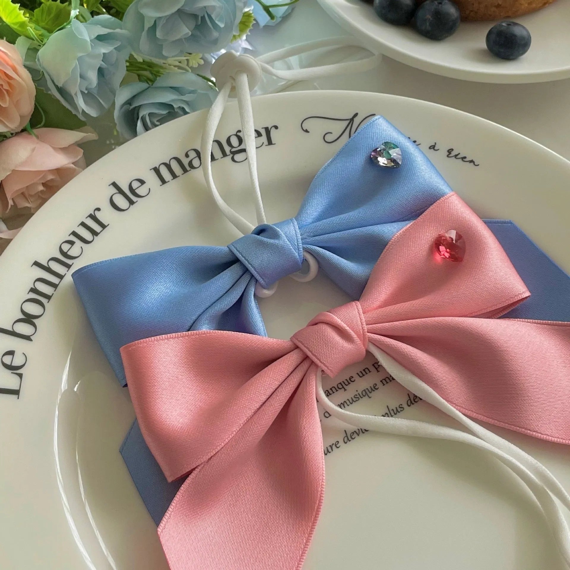 Adjustable dog hair band with princess style bow in blue and pink colours