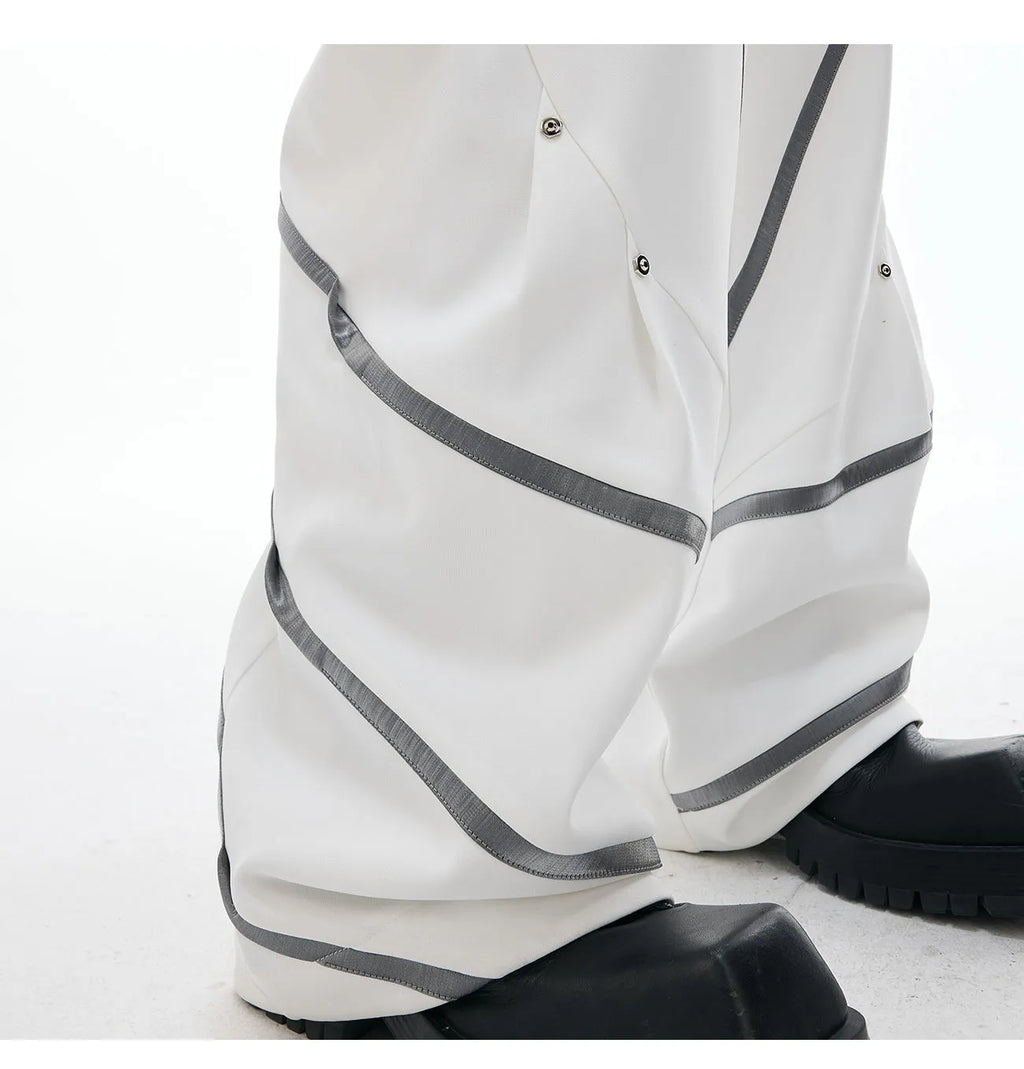 Men's polyester trousers with metal striped rivets and pleated design using three-dimensional cutting techniques