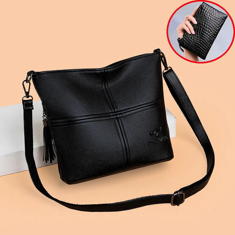 PU soft-leather-texture crossbody bag in red with stitching and tassels, horizontal shape, large capacity