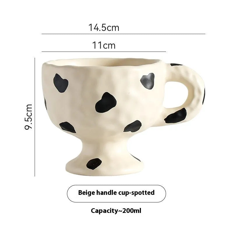 Hand-pinched irregular ceramic mug in a solid colour, shown from the side.