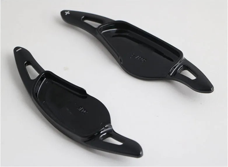 Carbon fibre pattern steering wheel paddle shift modification kit for car interior.