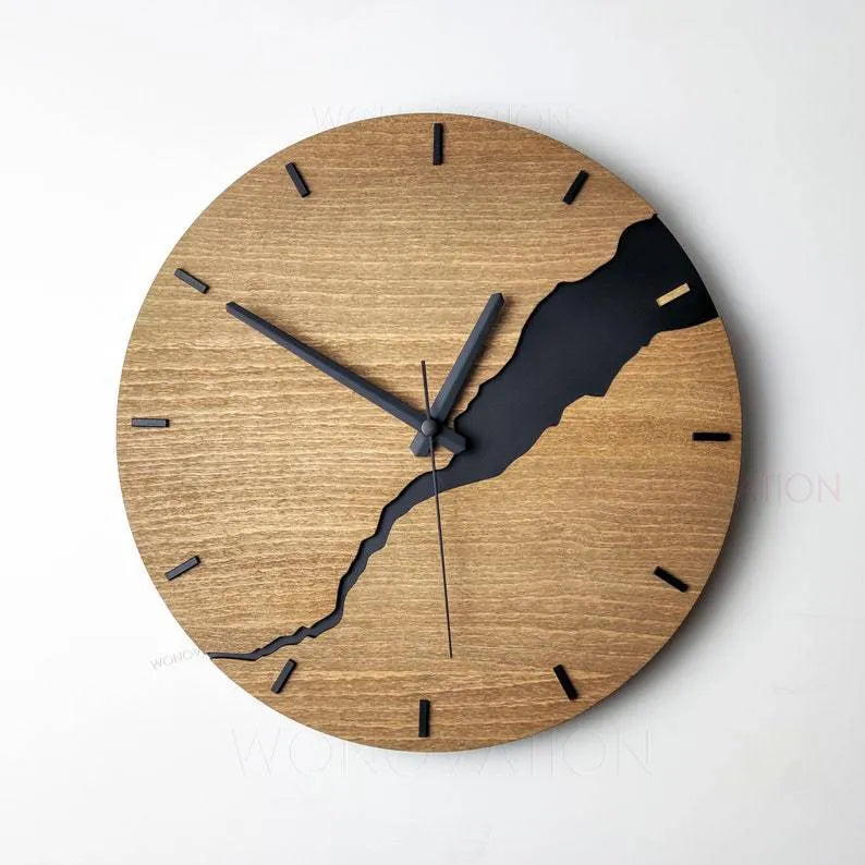 Modern round wooden wall clock with a cracked finish, 30cm in diameter.