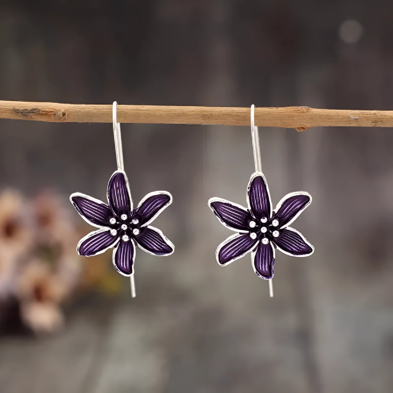 Pair of purple retro-style flower-shaped alloy earrings for women.