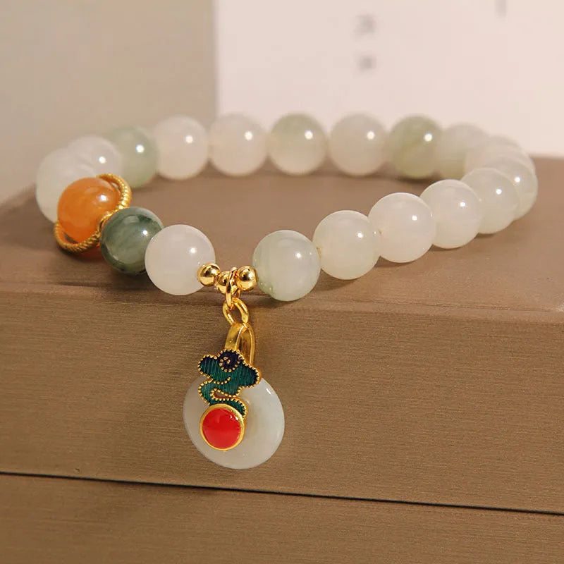Women's ice jade crystal bracelet with pearl accents and a jade buckle on a retro design.