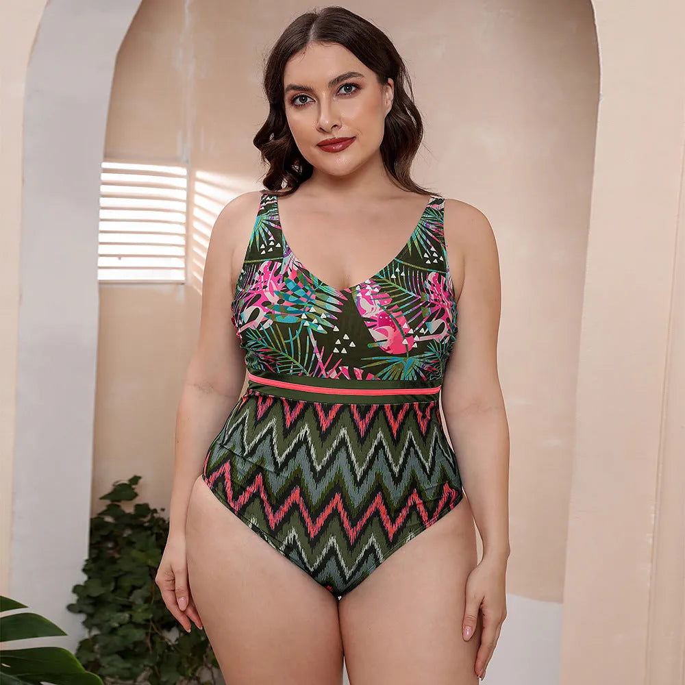Women's one-piece striped spaghetti strap swimsuit with printed patterns in blue, white, and green options.