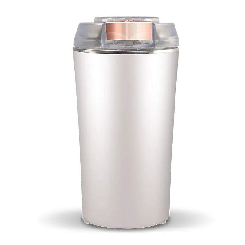 Blue manual mini flour mill and grinder for chili, pepper, and grains on a kitchen counter.