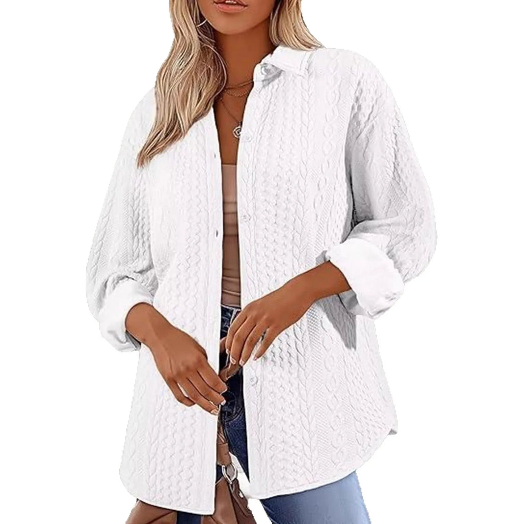 Women's solid colour knitted cardigan with contrast detailing in black, worn open over a white top