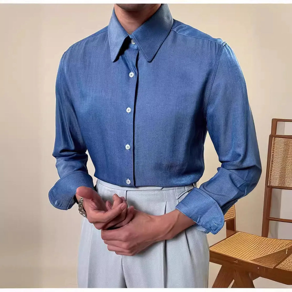Man wearing a slim-fit light blue round collar long sleeve shirt for business casual wear.