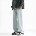 Men's light blue straight leg jeans with a button fly on a mannequin.