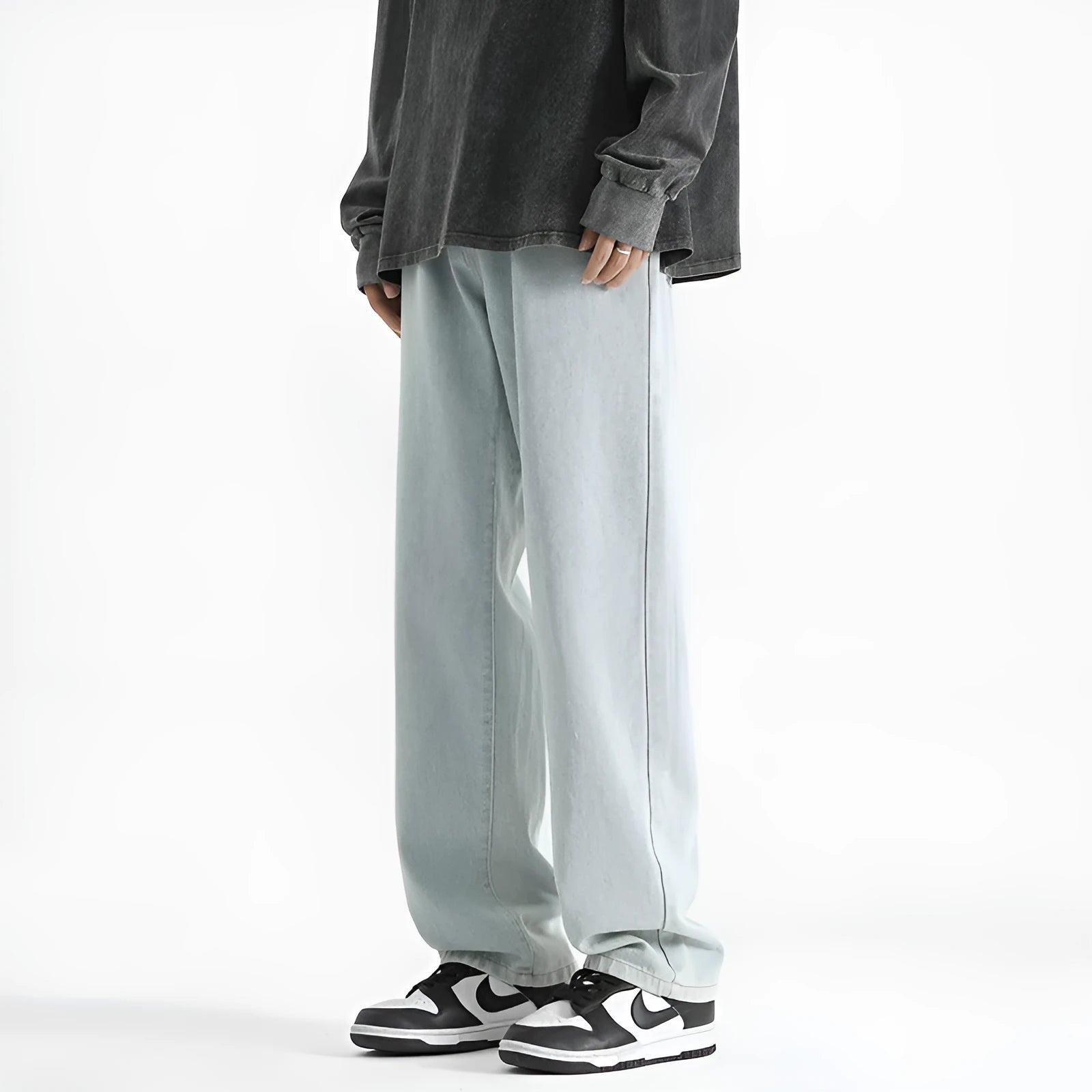Men's light blue straight leg jeans with a button fly on a mannequin.