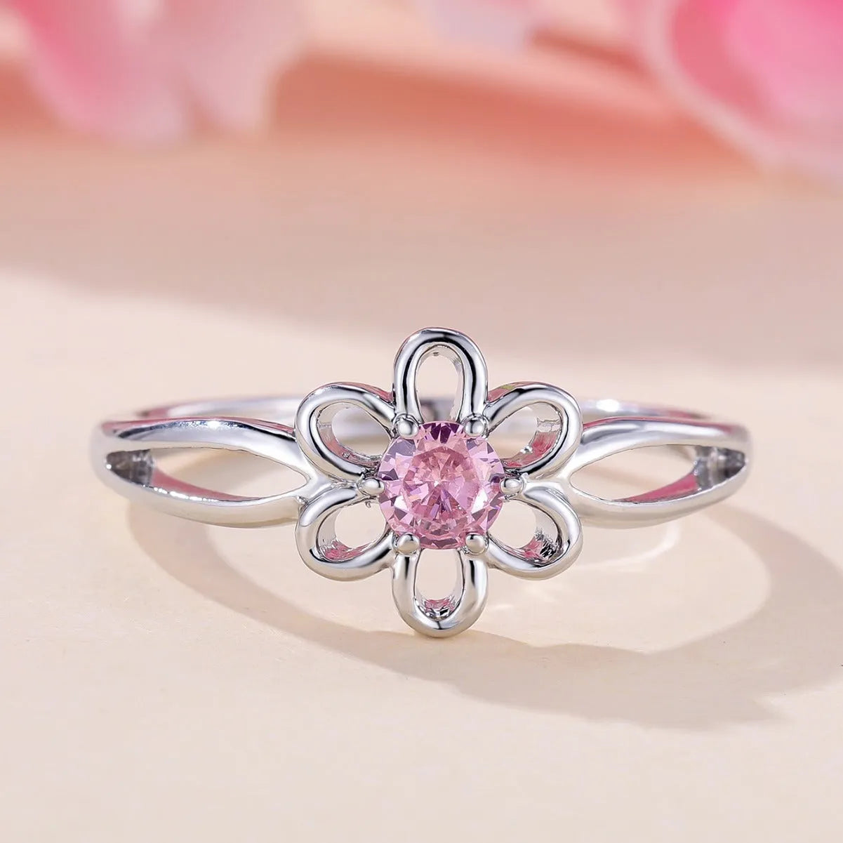 Women's hollow flower design ring in platinum pink diamond colour with white gold powder accents