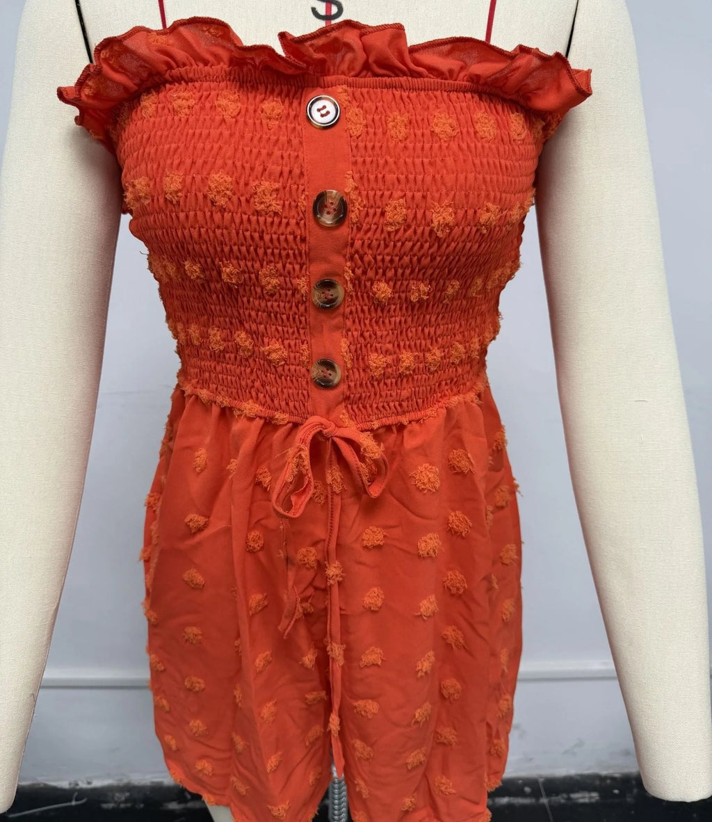 Women's solid colour off-shoulder jumpsuit in polyester fabric showing sleeveless design and mid waist fit