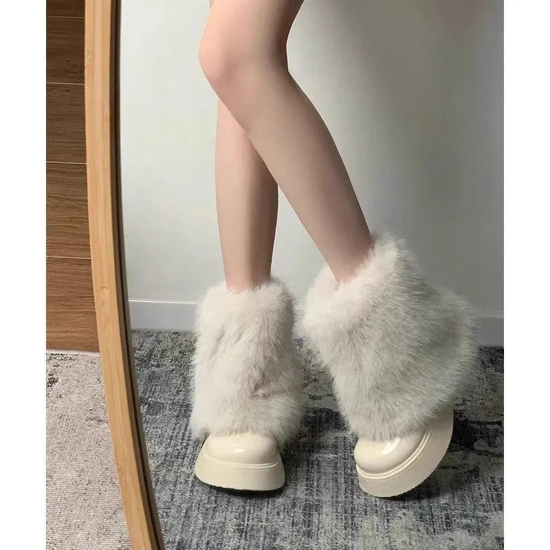 Women's black artificial plush snow boots with a low-top design and a waterproof rubber platform sole.