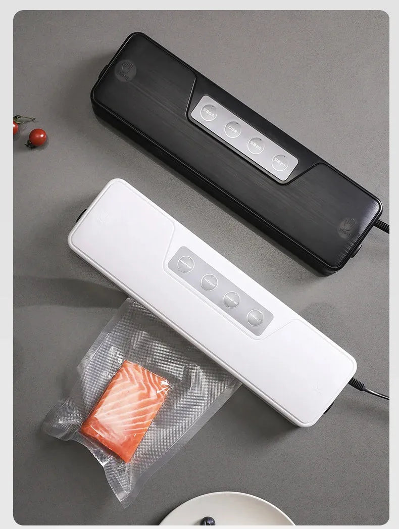 White compact automatic vacuum sealer machine for household food preservation on kitchen counter