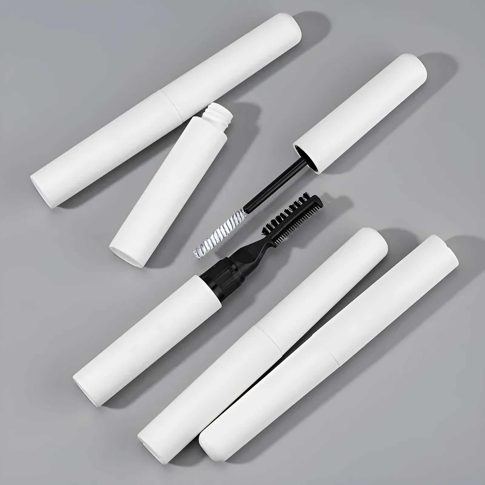 Eyebrow glue bottle with applicator brush for natural eyebrow shaping
