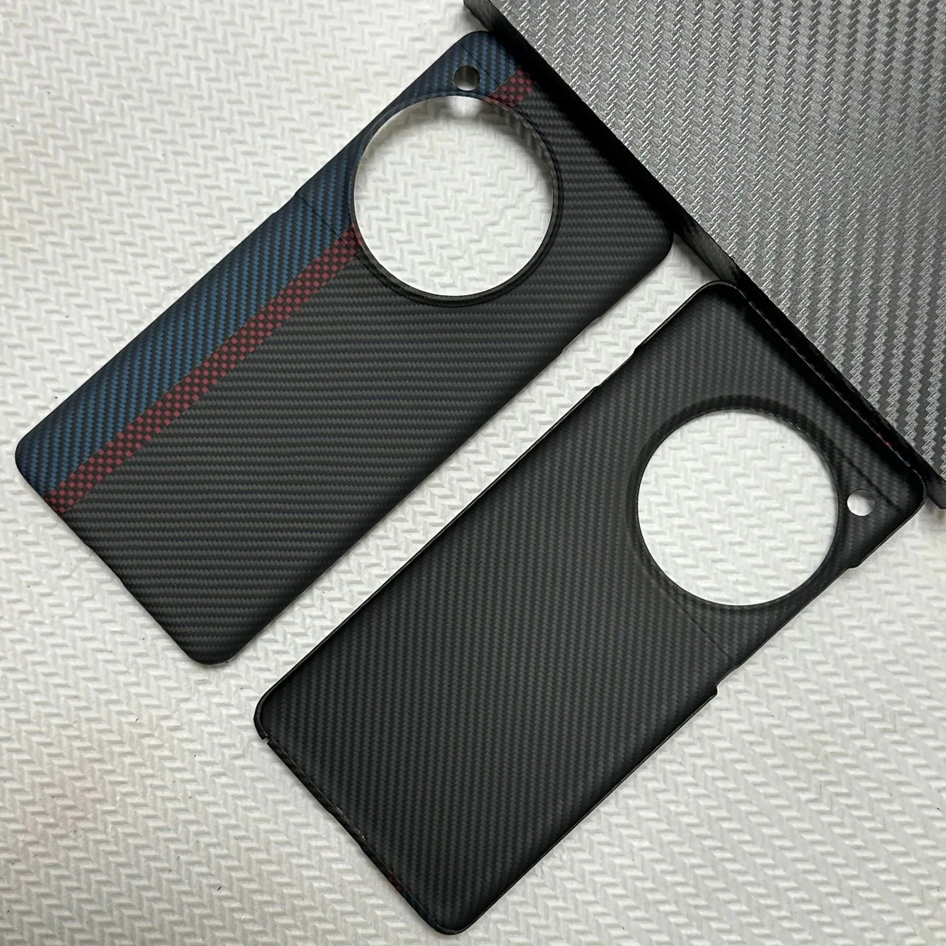 Black hand-woven Kevlar anti-wear phone case for OnePlus 12 with crater texture
