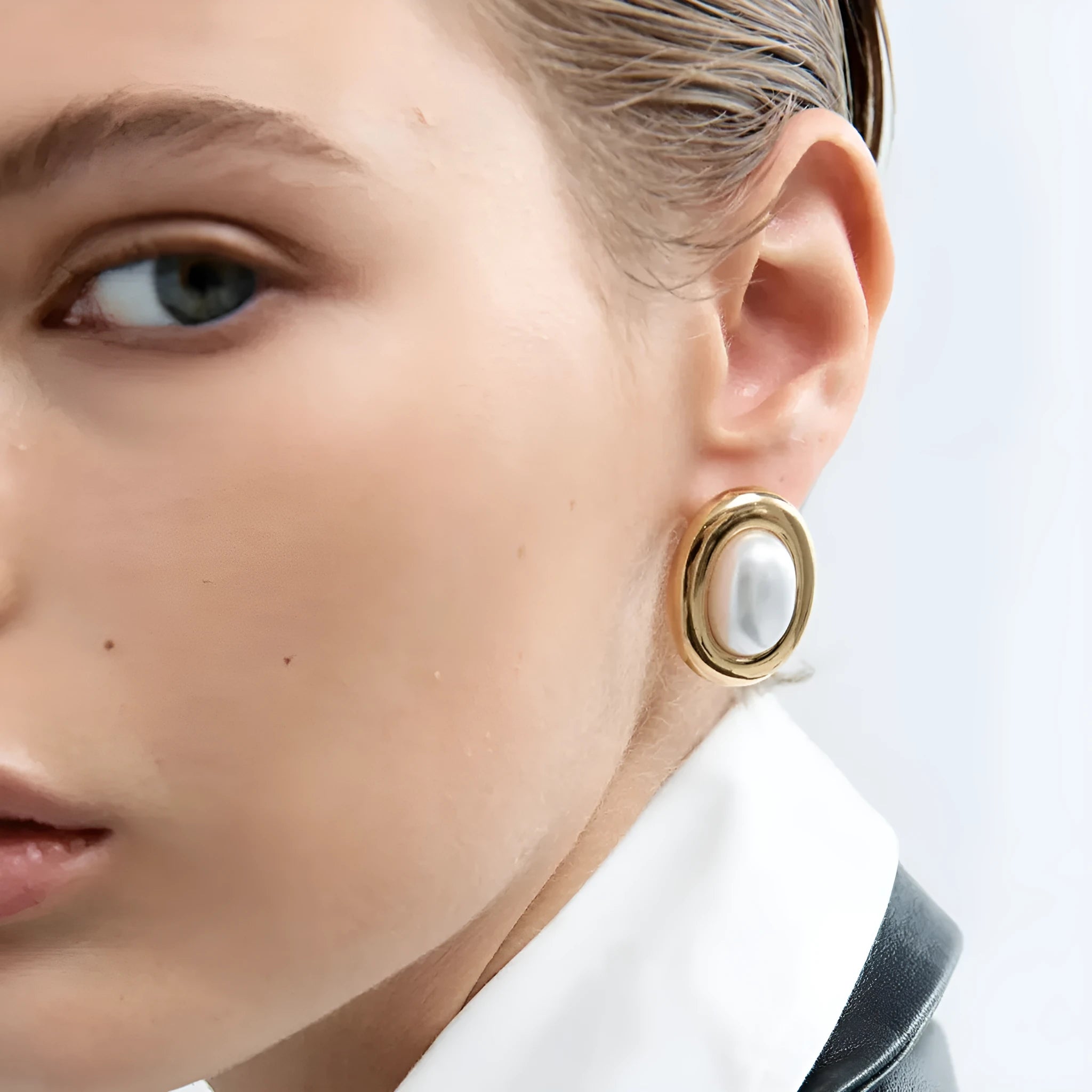 Close-up of stainless steel vintage pearl ear studs for women with a non-fade electroplated finish.