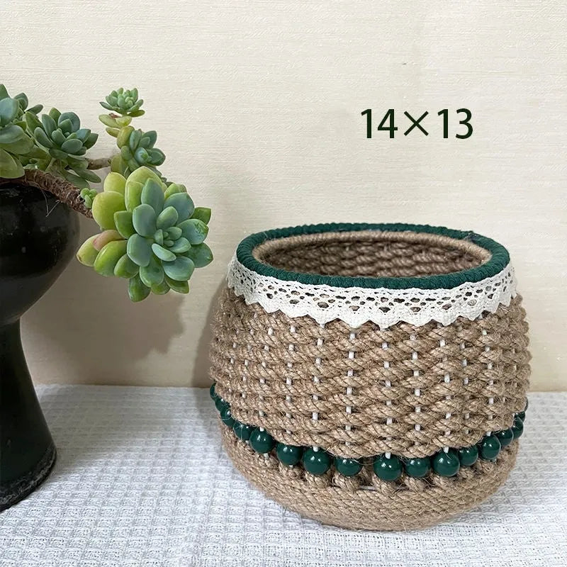 Rattan hand woven cylinder storage basket in green on desktop holding snacks and keys
