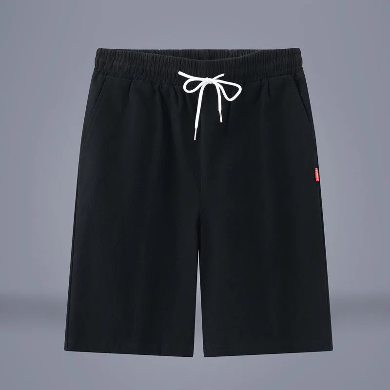 A pair of solid colour cotton linen cropped pants with a drawstring waist, shown in Army Green.