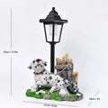 Solar powered resin garden lamp with decorative animal character design for outdoor lighting
