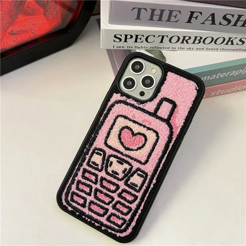 Pink towel embroidered soft TPU back cover case for Apple iPhone mobile phones.