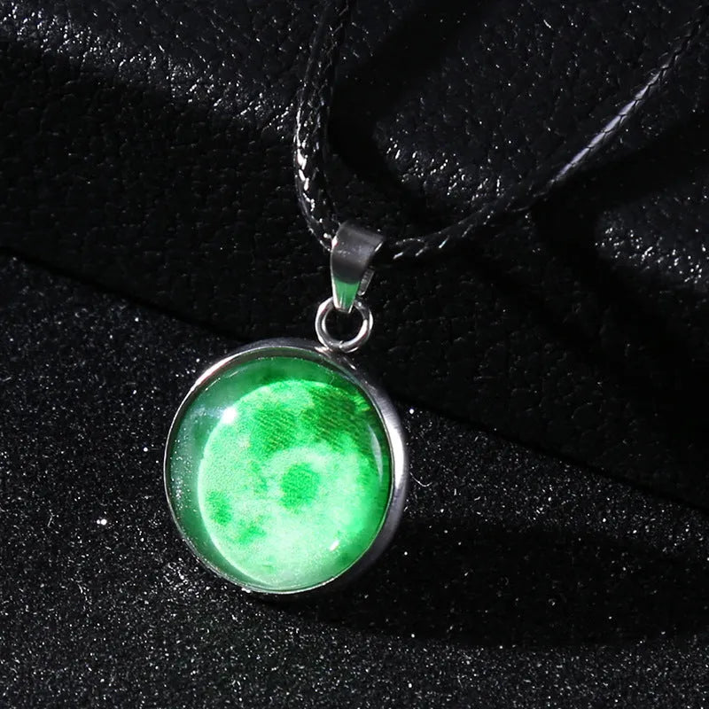 Luminous moon and constellation night sky pendant on an extendable alloy necklace chain.