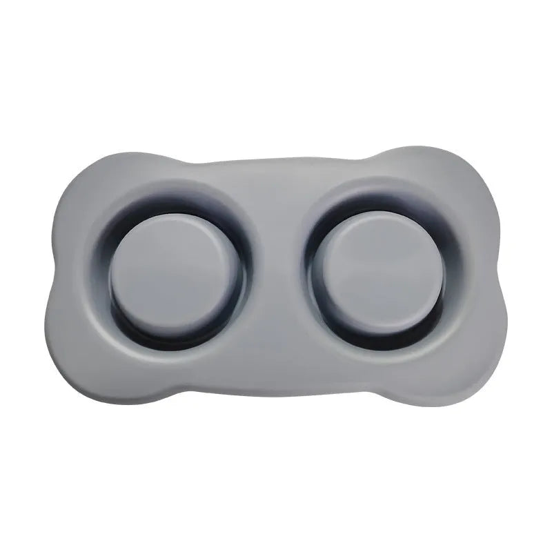A large silicone double dog bowl with a non-slip base and integrated feeding mat, shown in sky blue colour.