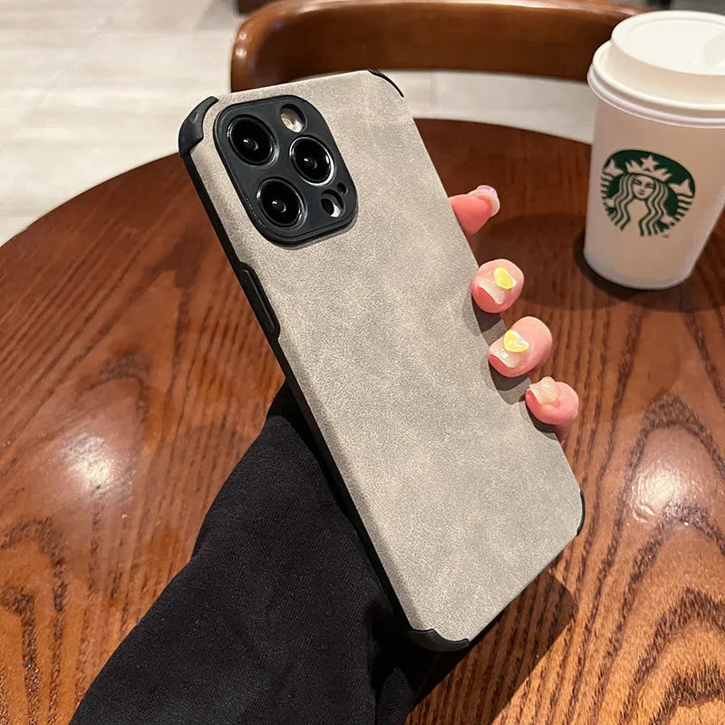 Simple solid colour fur phone case with imitation leather texture for iPhone fall prevention, available in black, blue, and green
