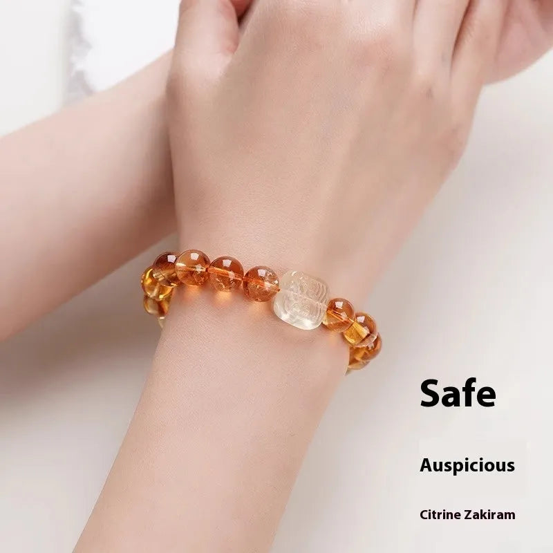 Women's carved citrine bracelet with geometric patterns on 10mm crystal beads in ethnic style