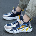 Boys dark blue and beige sports running shoes with Velcro strap and mesh upper.