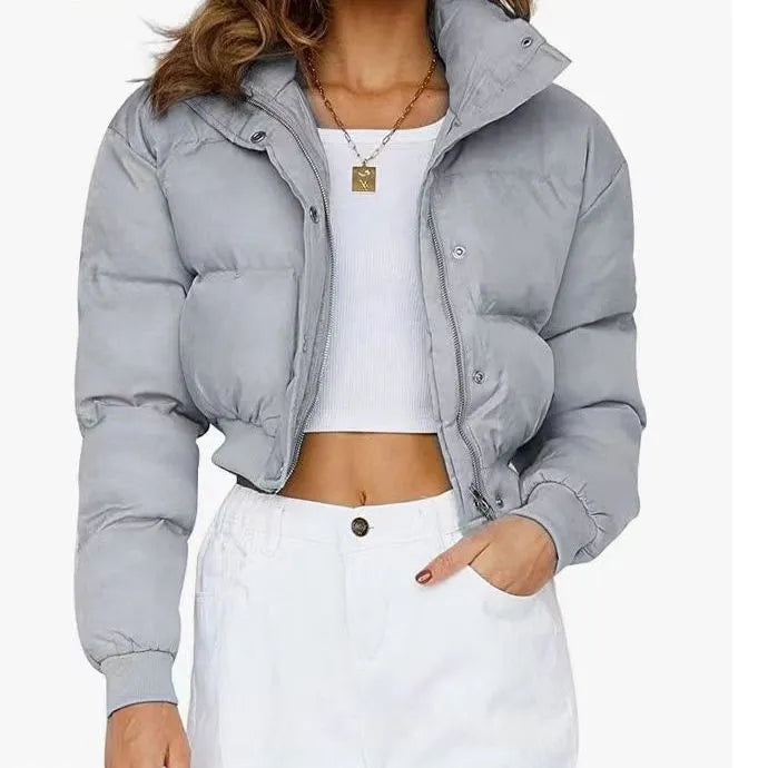 Women's loose fit long sleeve polyester jacket in blue, shown on a hanger.