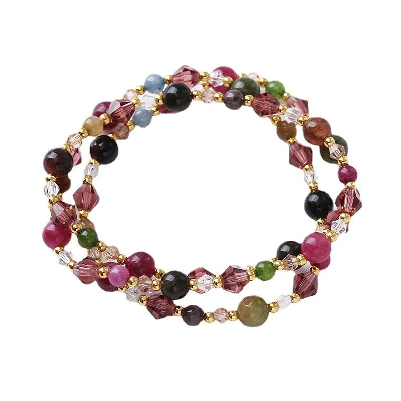 Handmade three-ring bracelet with colourful tourmaline, strawberry quartz, and amethyst beads on an adjustable cord.