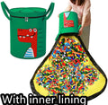 Green felt cube storage bag with pull rope closure opened as play mat