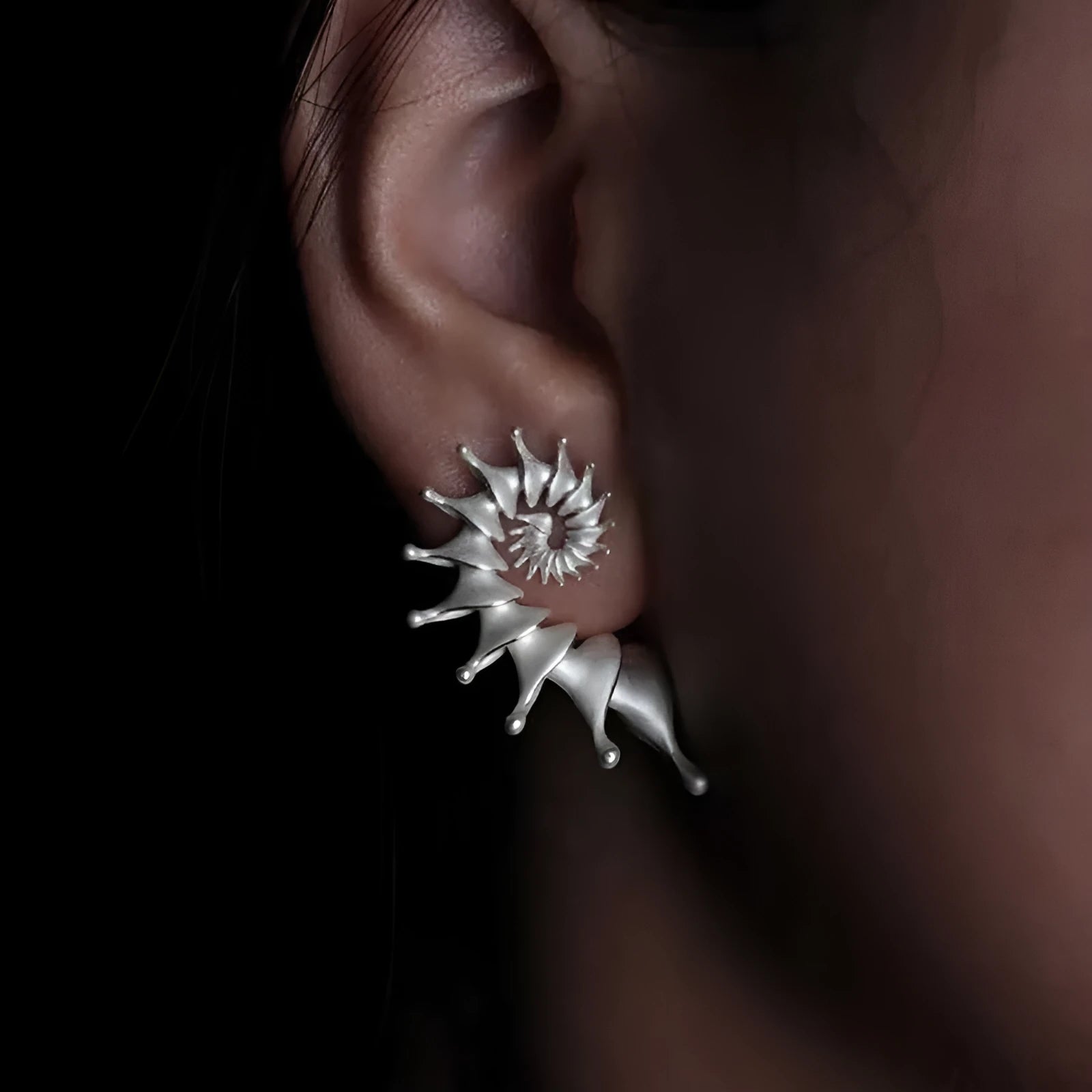 Matte finished conch stud earrings with three-dimensional alloy design