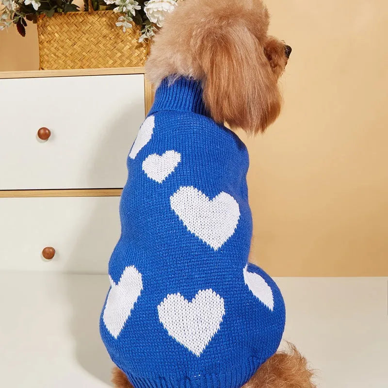 Pink knitted acrylic dog sweater for Valentine's Day, size M, on a small dog