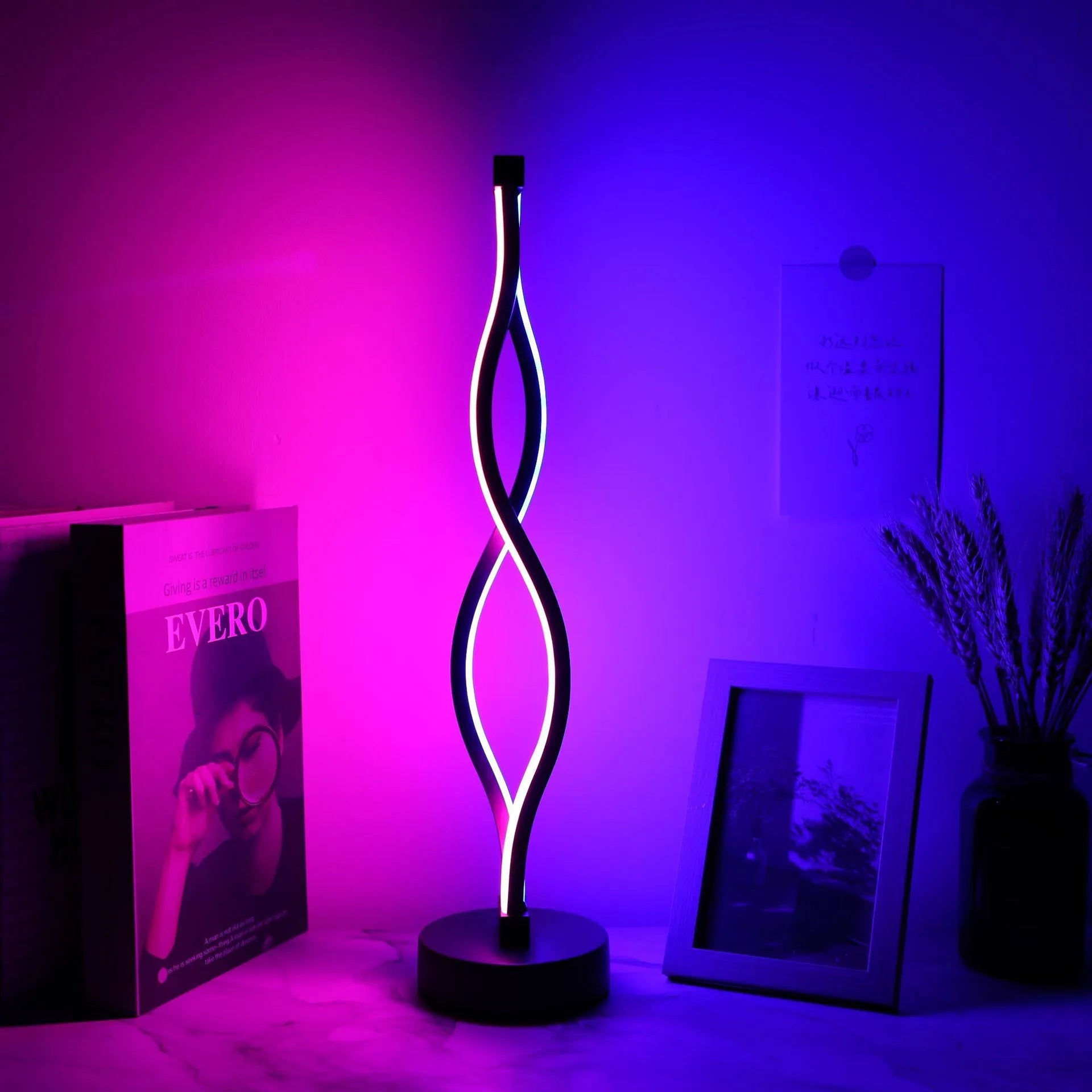 Black aluminium desk lamp with touch dimming buttons showing blue and pink controls
