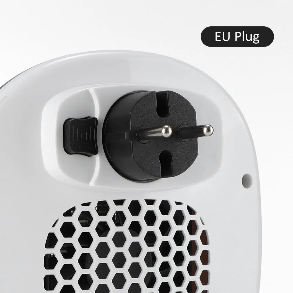 White ceramic electric heating blower with remote control on table